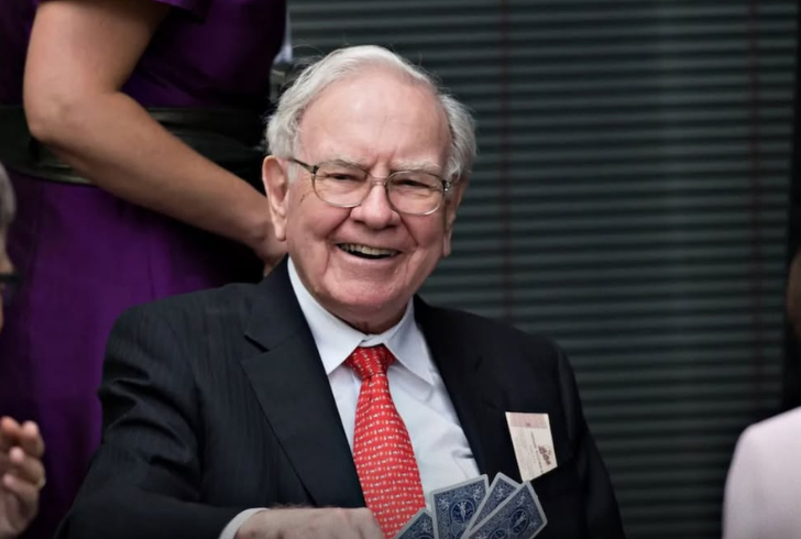 Warren Buffett smiling during charity event.